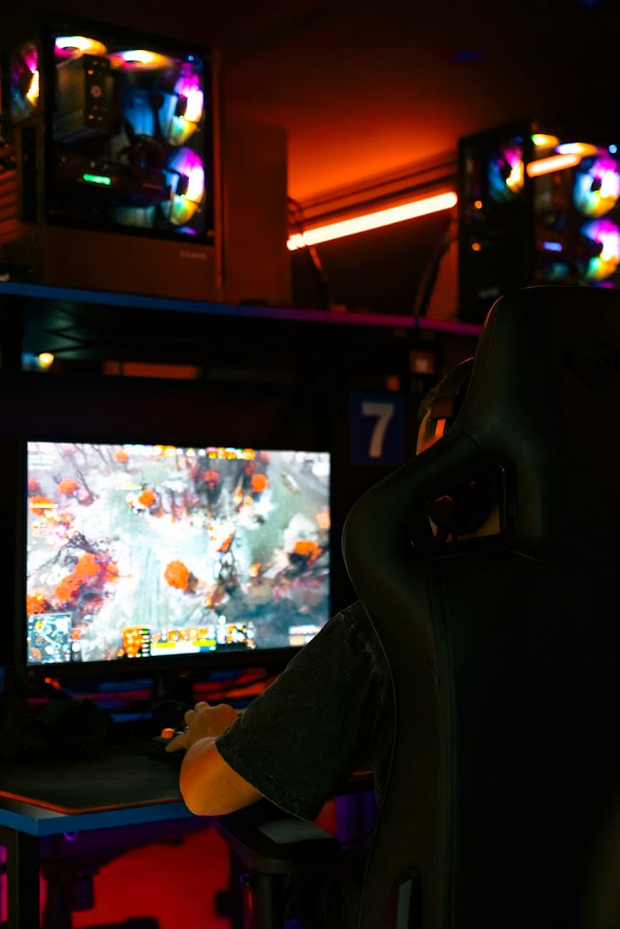 Gaming station with monitor, keyboard and headset at Mercury Cyber Club